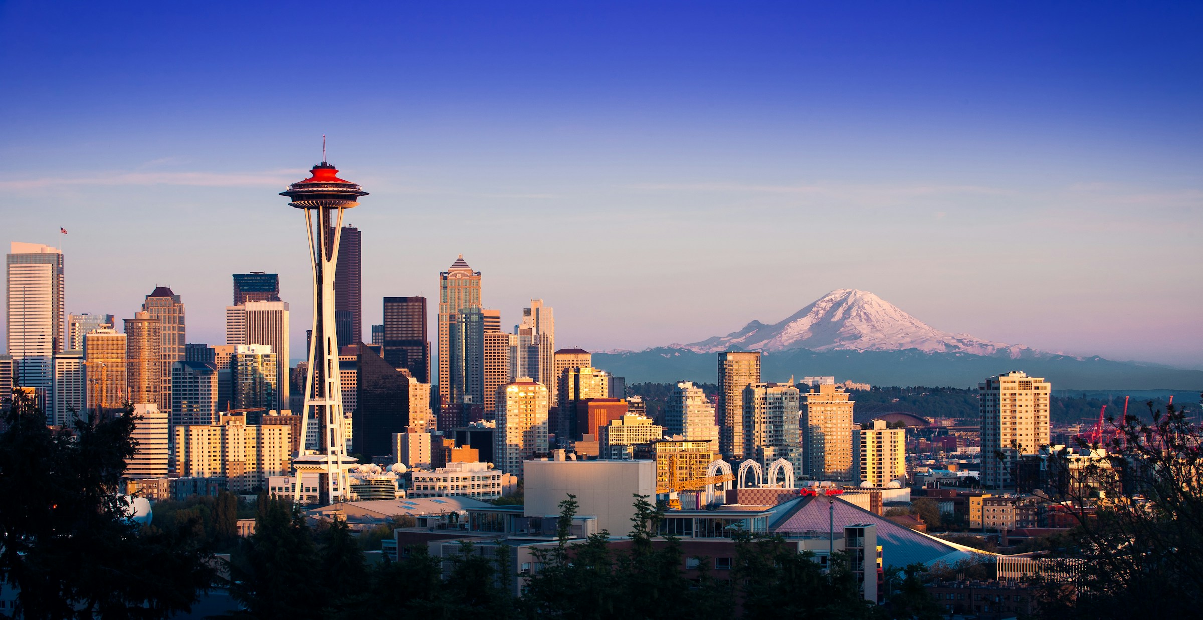 Seattle skyline at sunset with Space Needle and Mount Rainier